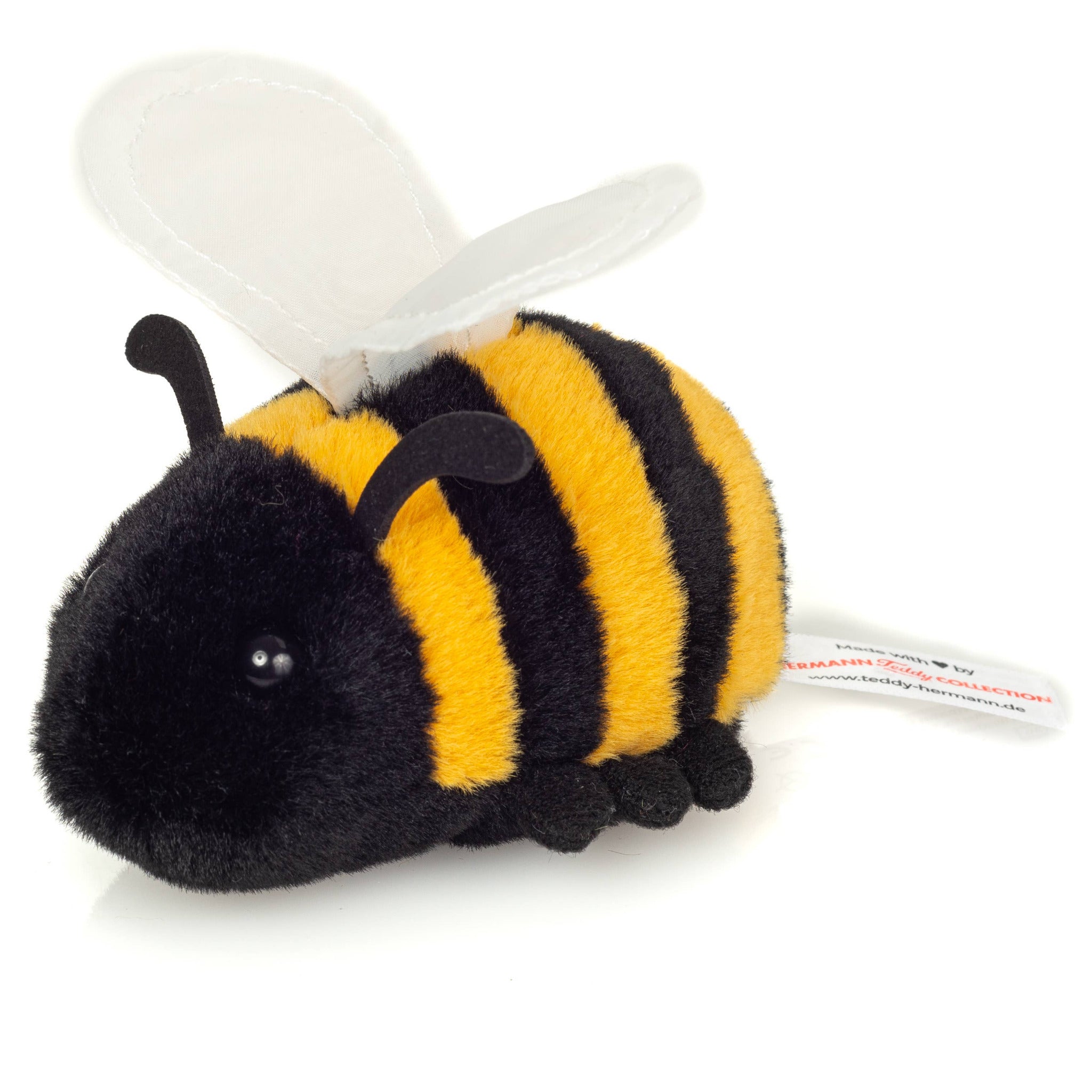 Plush bee toy with black and yellow stripes on a white background