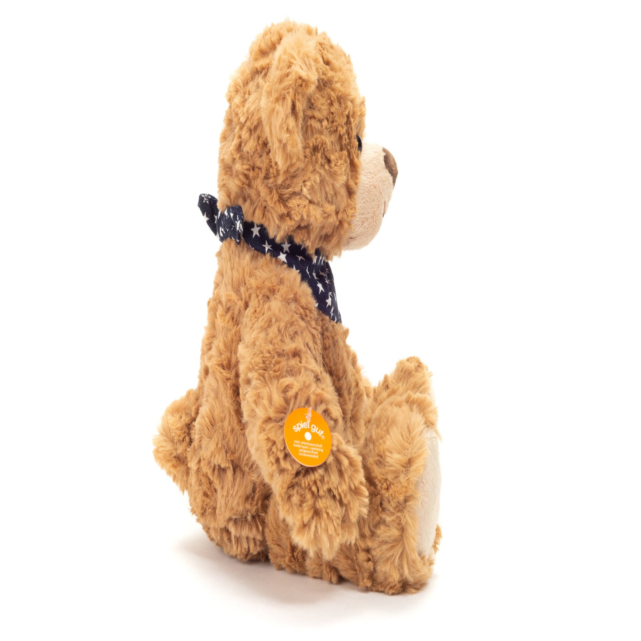 Brown teddy bear with a blue ribbon on a white background