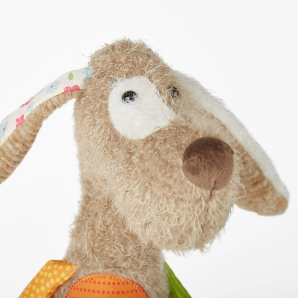 Close-up of a plush toy with a colorful background