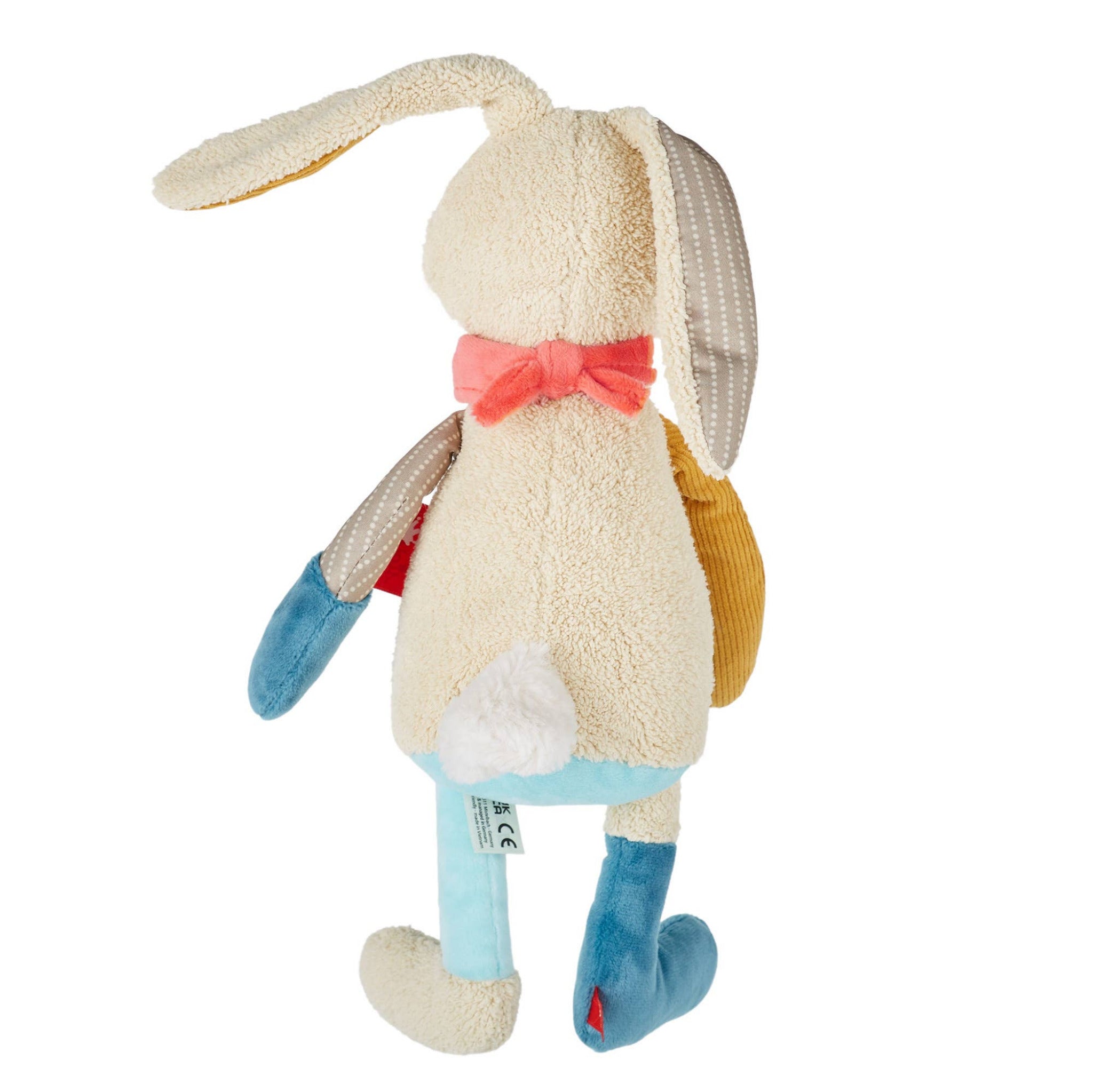 Plush toy rabbit with a yellow hat and pink bow on a white background