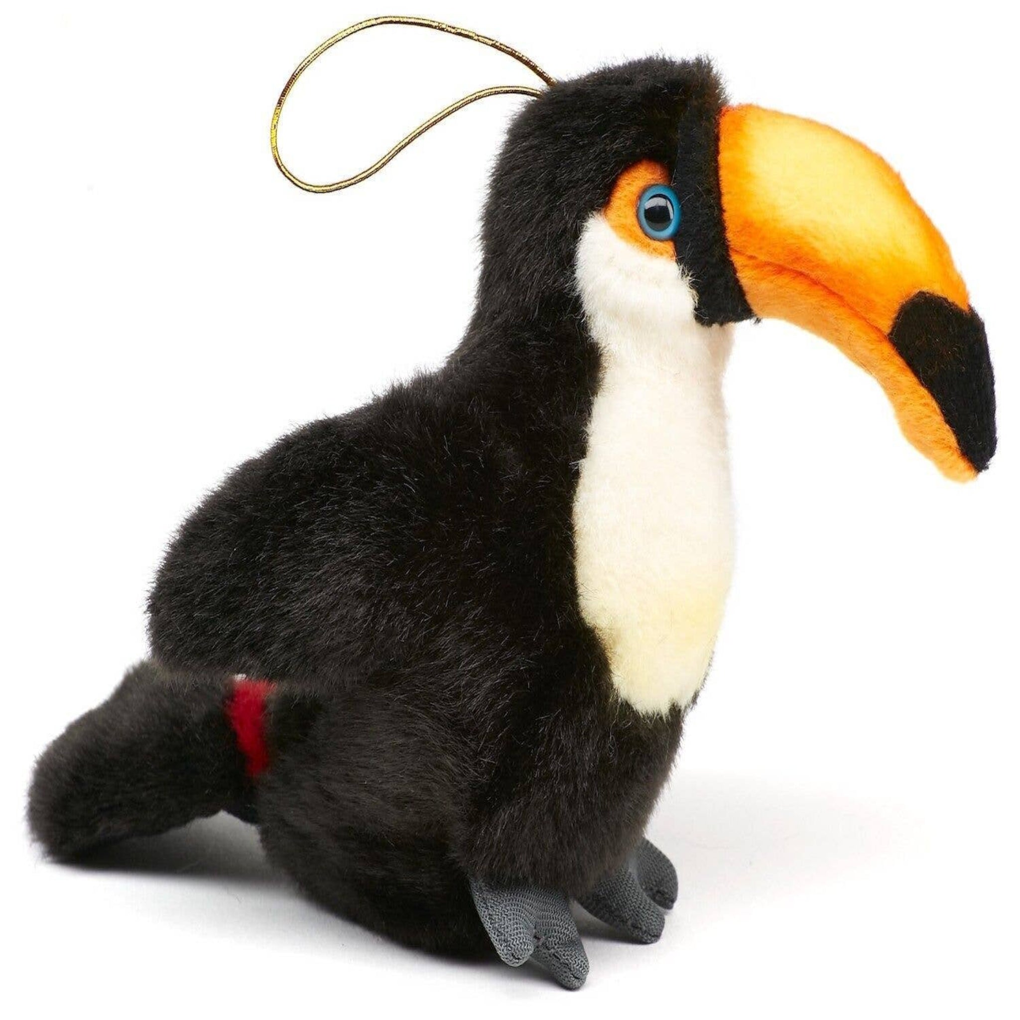 Plush toy toucan with a colorful beak on a white background