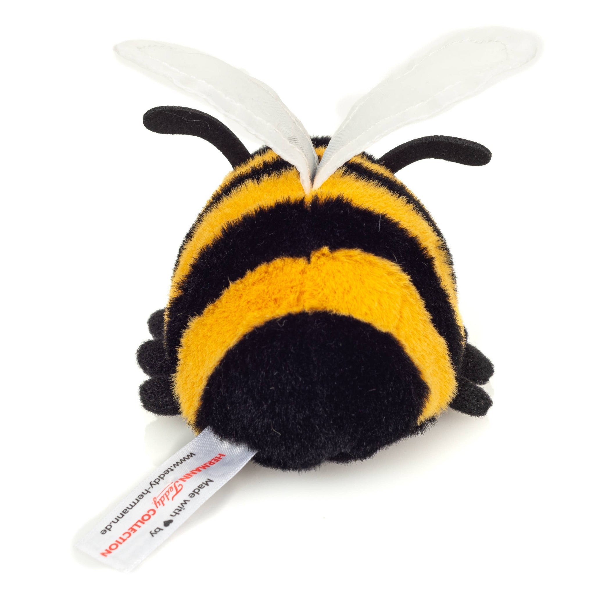 Plush bee toy with black and yellow stripes on a white background