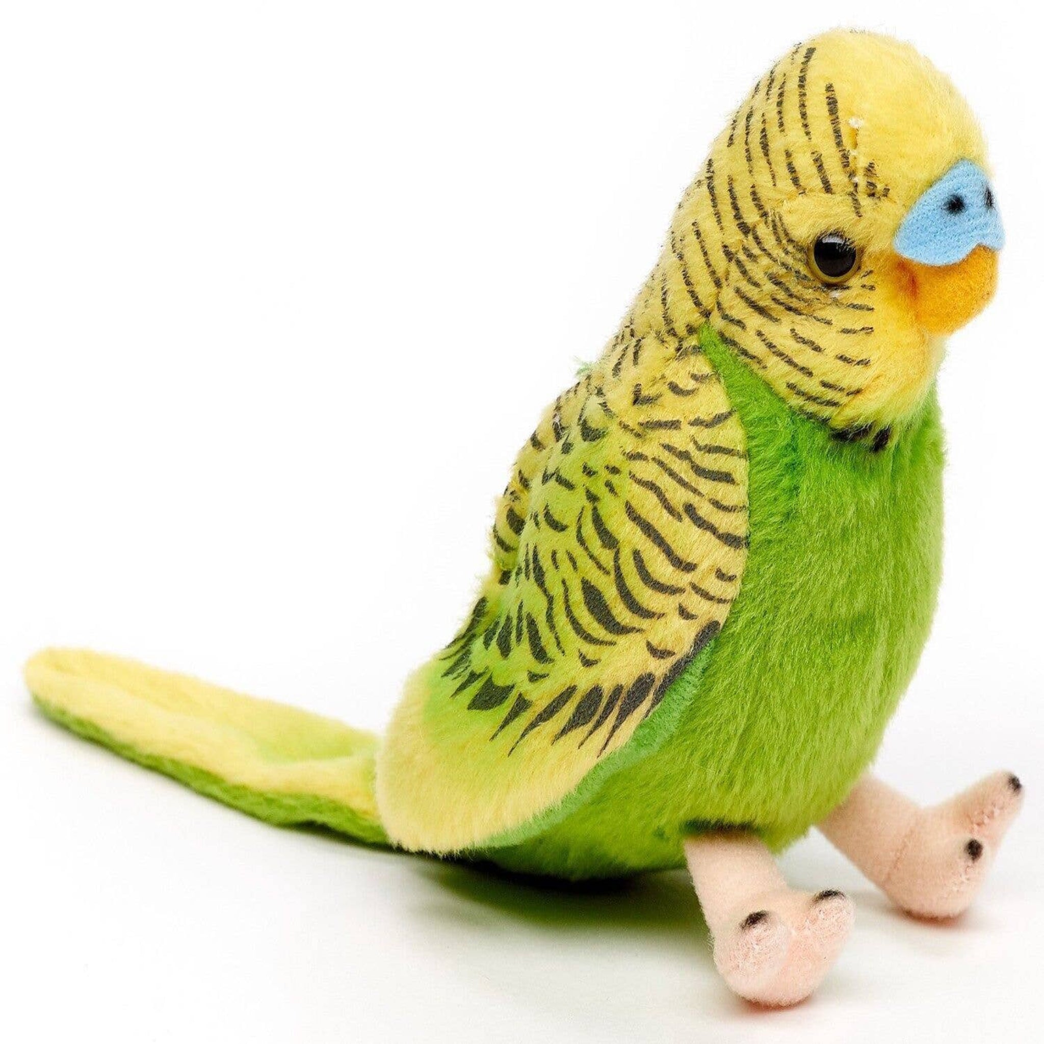Plush toy parakeet with green body and yellow head on a white background