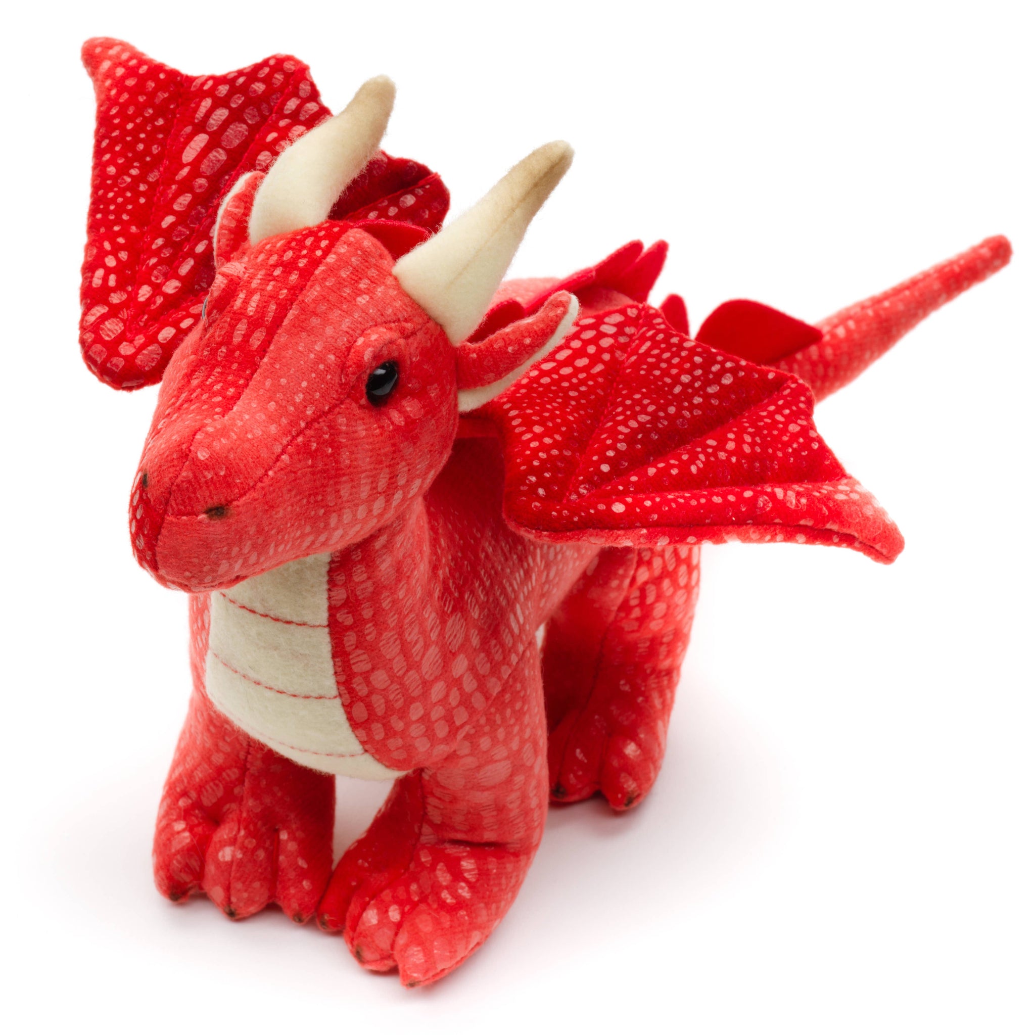Red plush triceratops toy on a white background