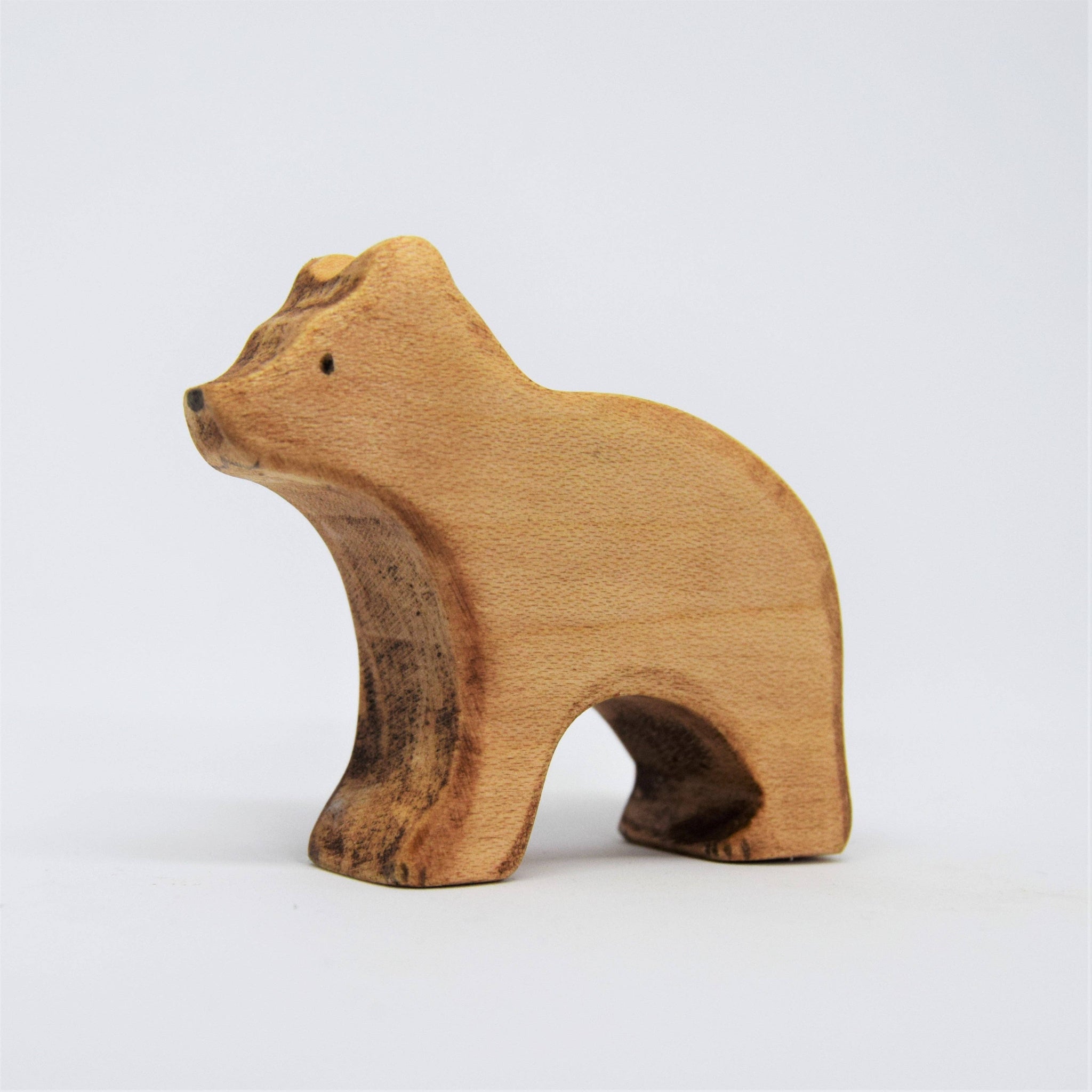 Wooden bear figurine on a white background