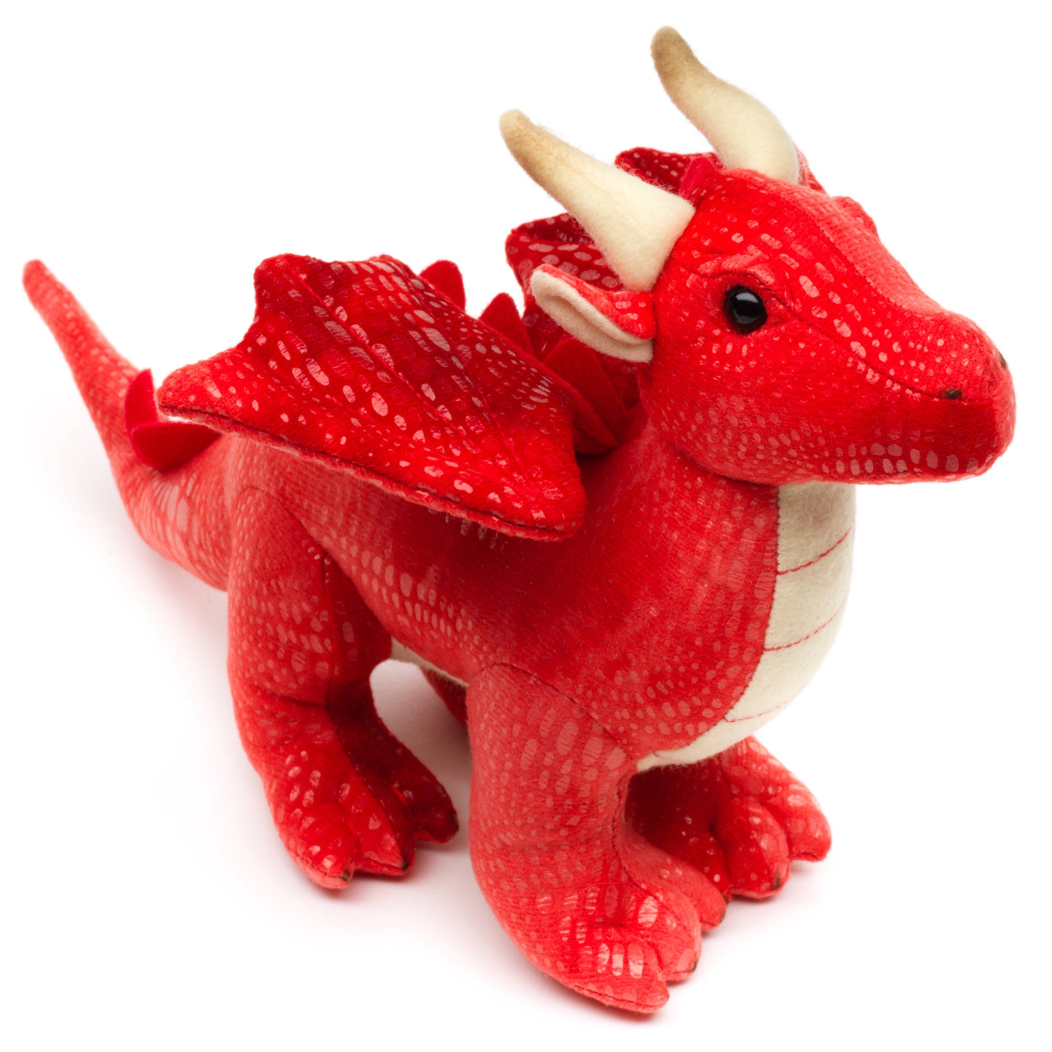 Red toy dragon with white horns on a white background