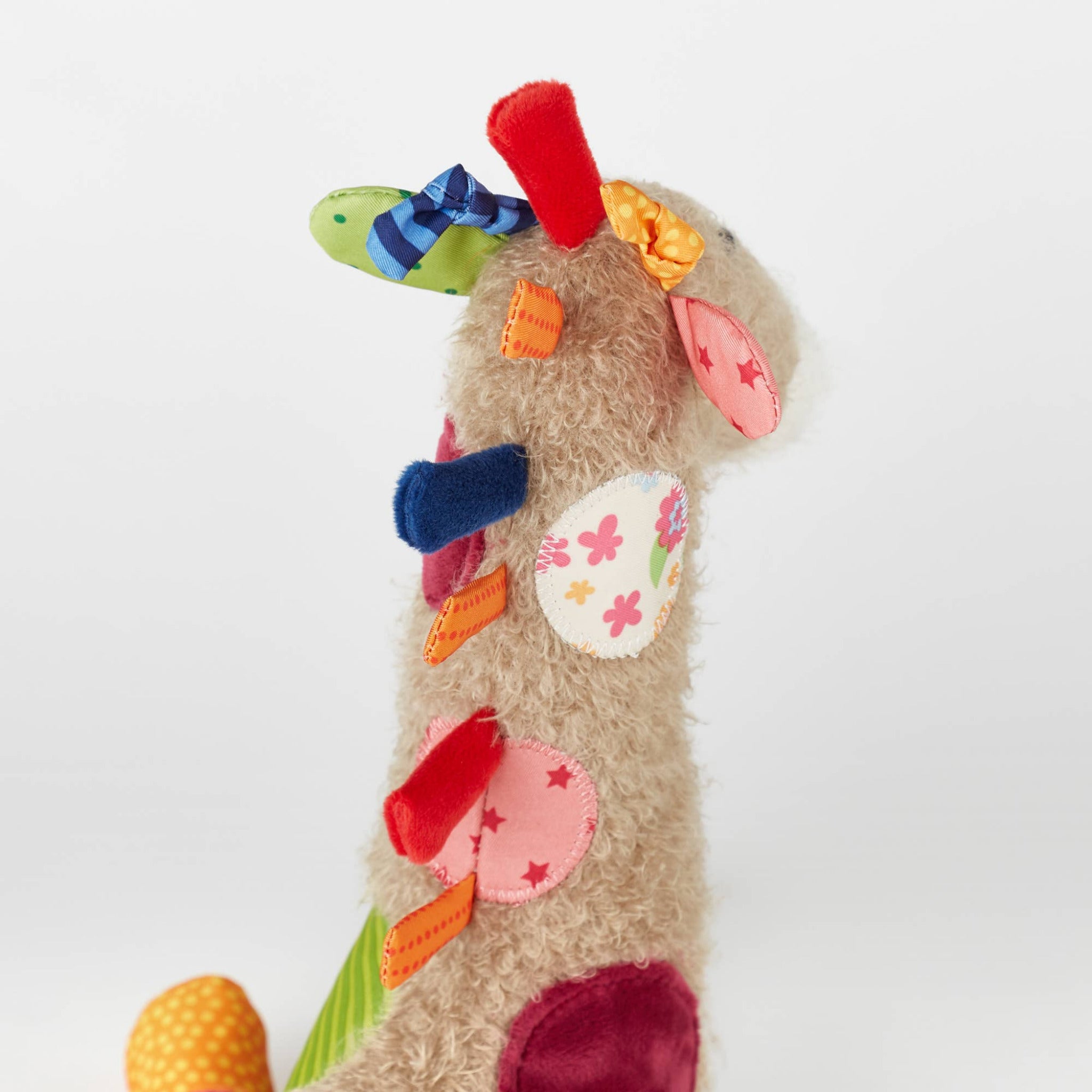 Colorful children's sock with decorative elements on a white background