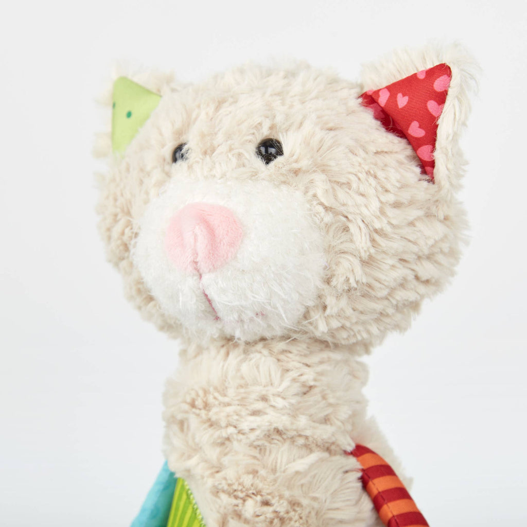 Plush toy with a colorful hat on a white background