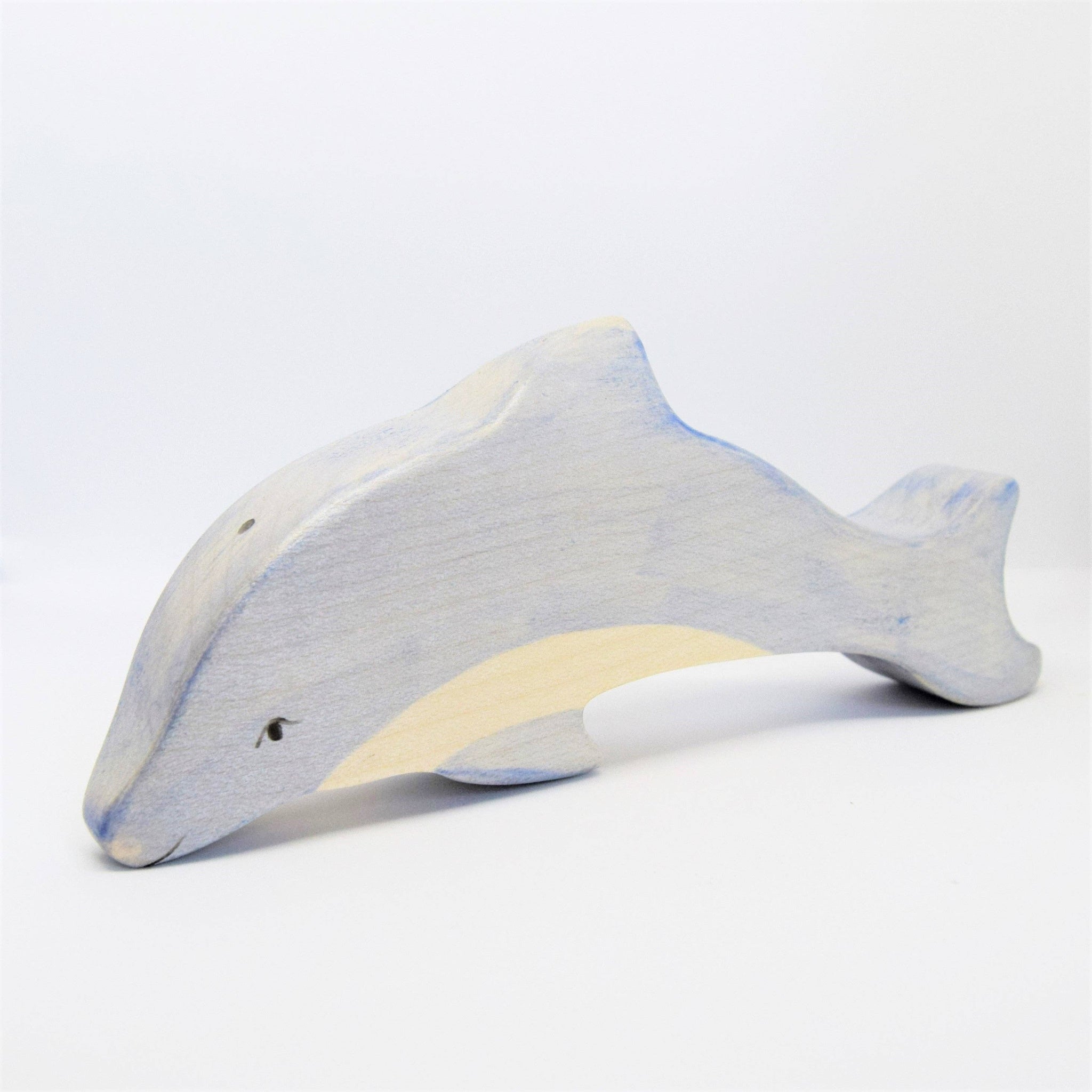 Plush toy dolphin on a white background