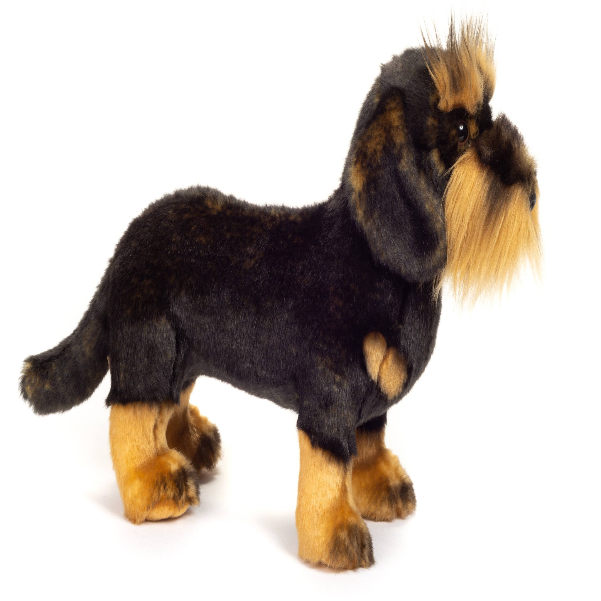 Plush toy dog with black and brown fur on a white background
