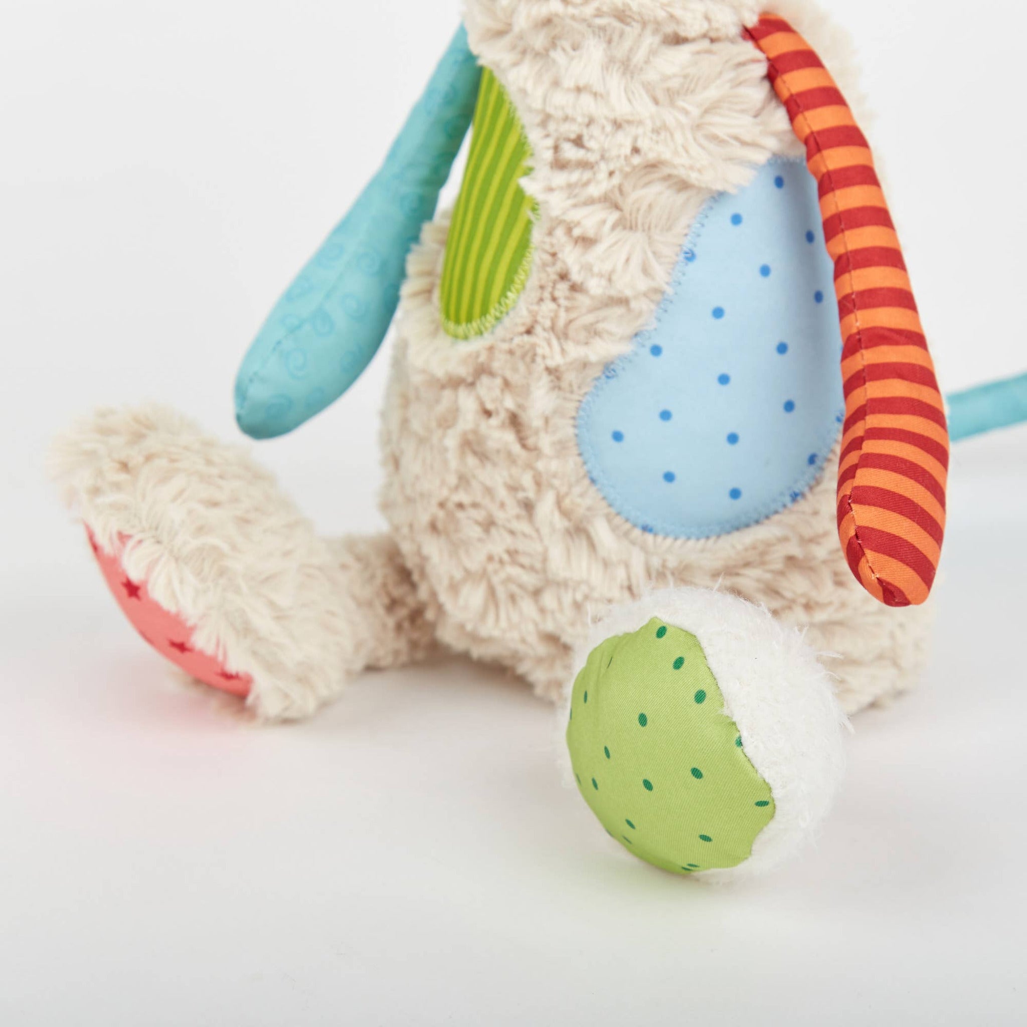 Colorful plush toy with a soft texture on a light background