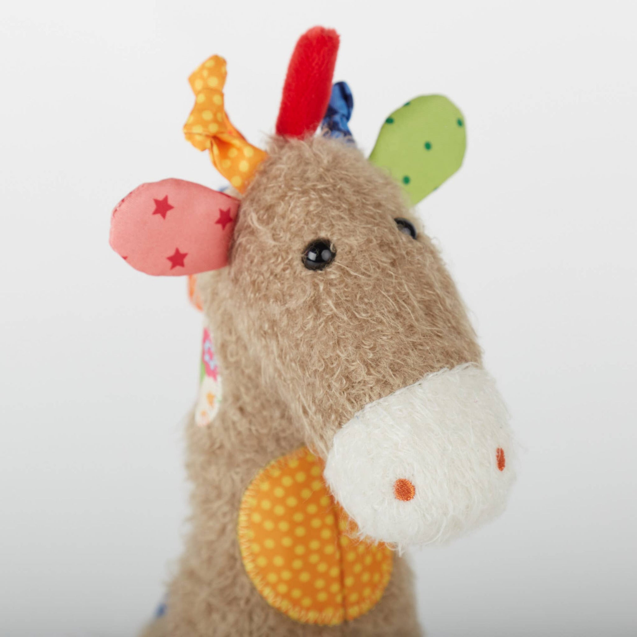 Plush toy with colorful accents on a white background