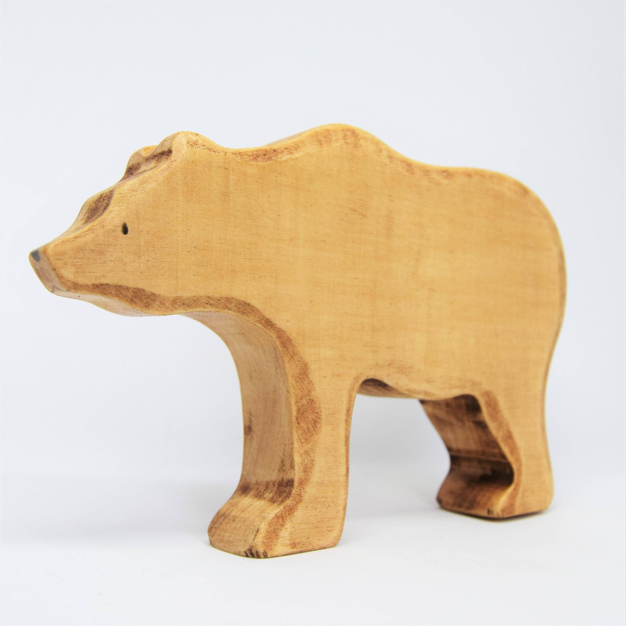 Wooden bear figure on a white background