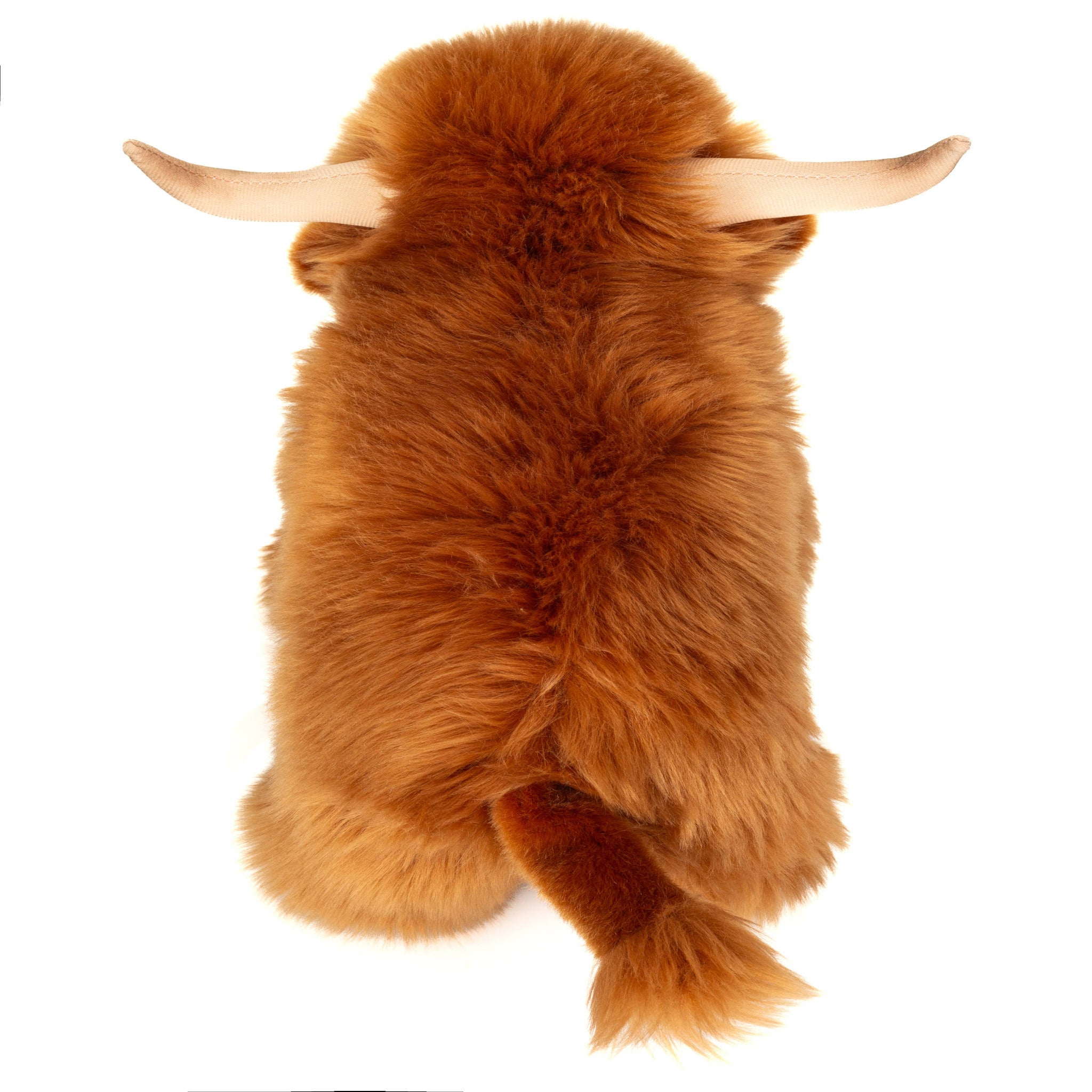 Plush toy of a brown yak with horns on a white background