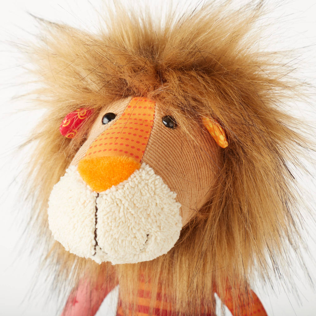 Close-up of a plush lion toy with a white background