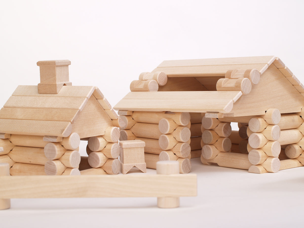 111 Parts Construction Set by VARIS, built as log houses, close view