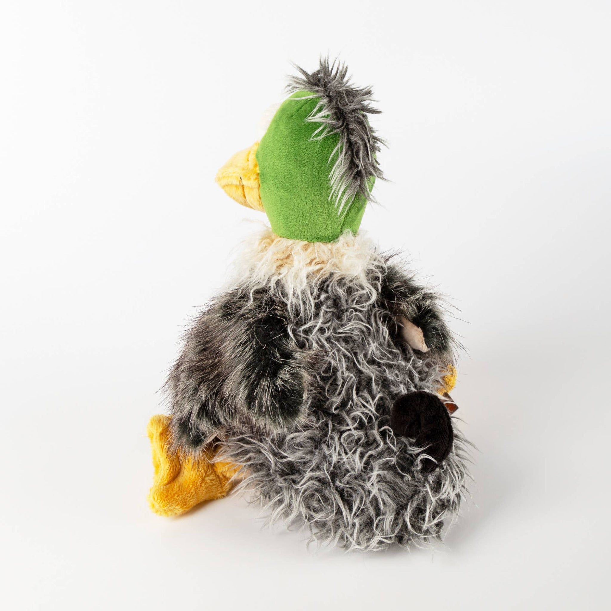 Plush toy resembling a duck with a green head on a white background