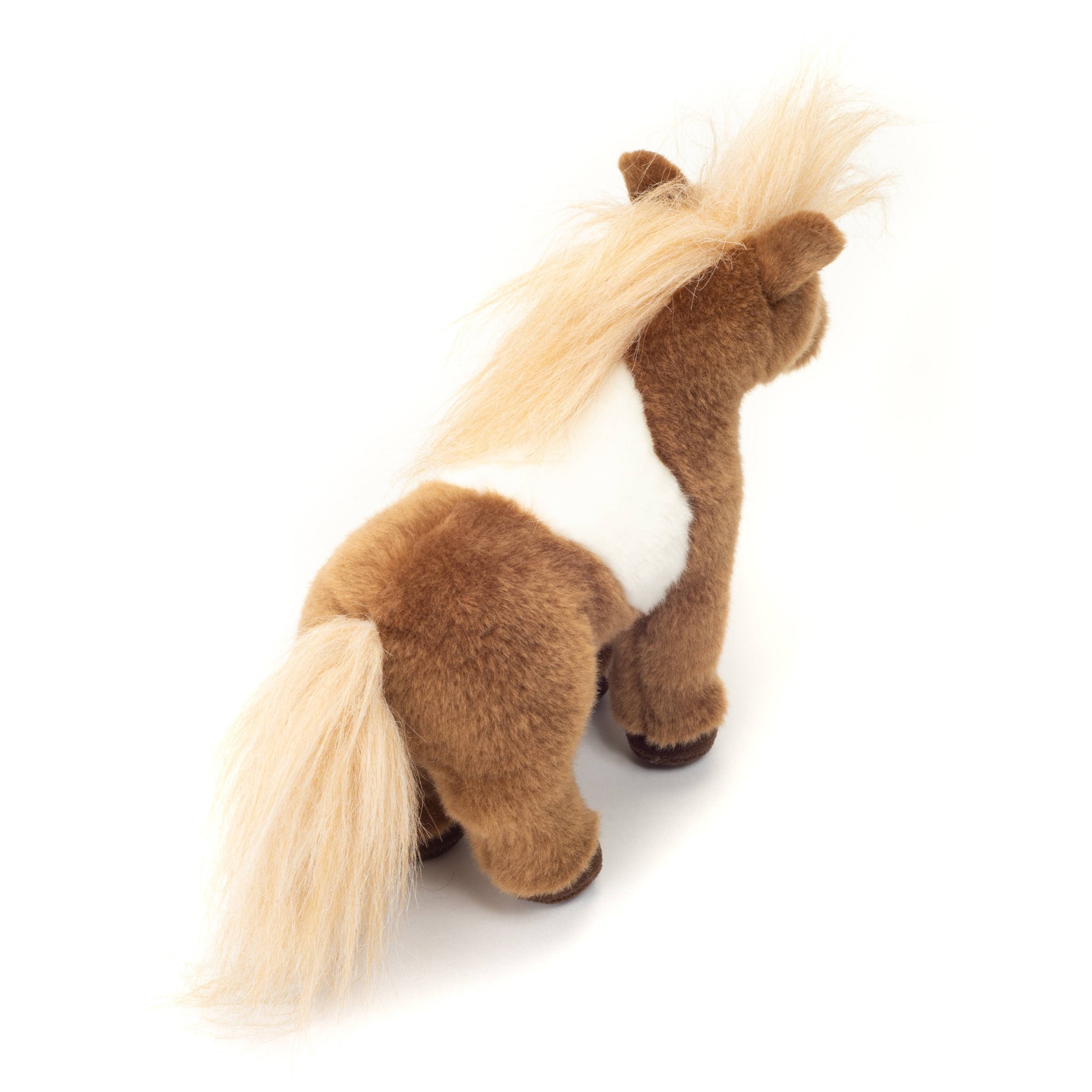 Plush toy horse with a white belly on a white background