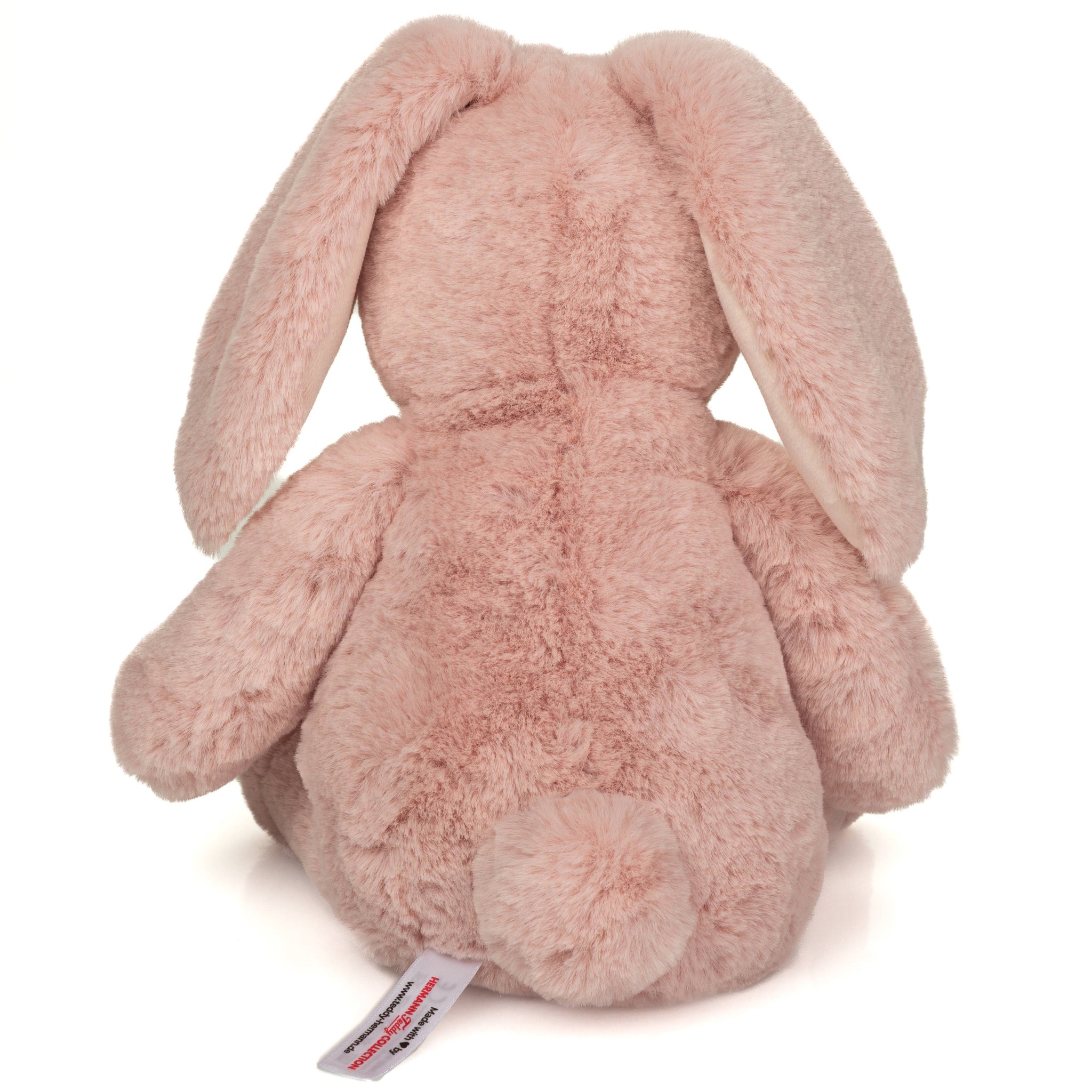 Pink plush bunny toy on a white background