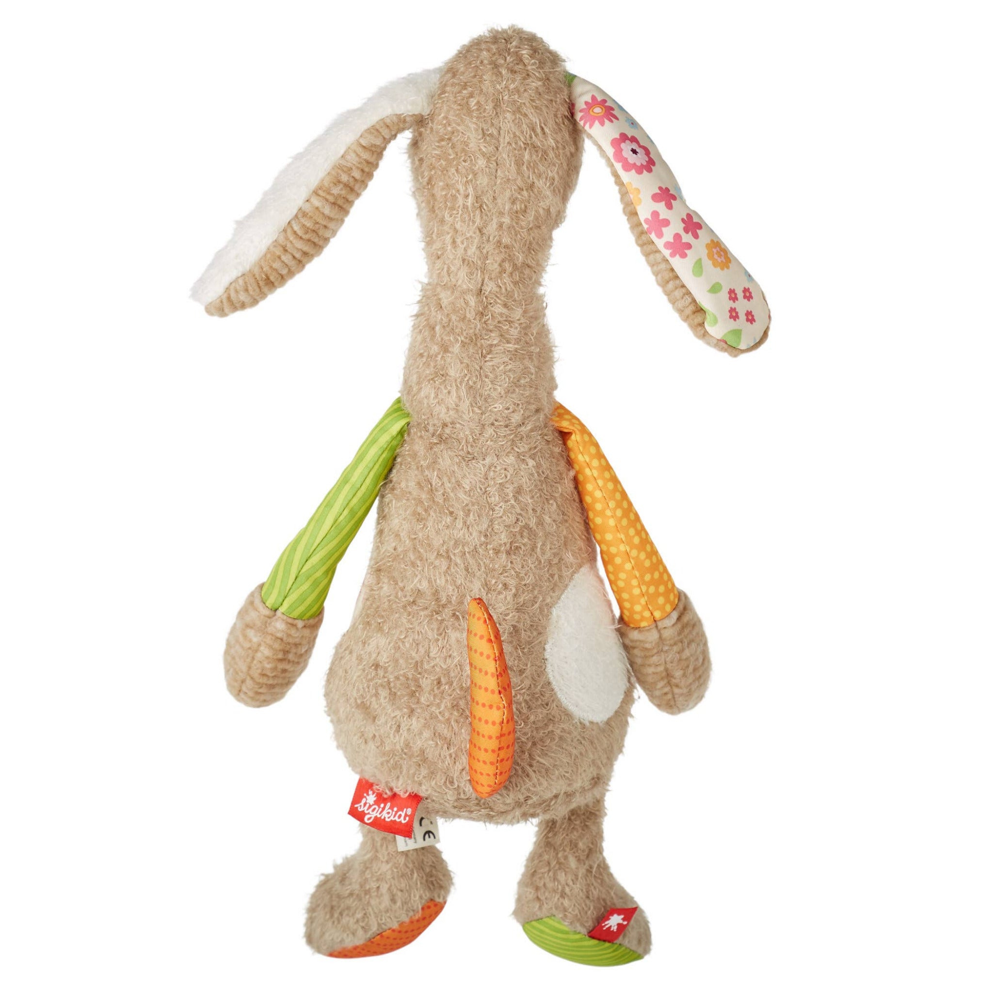 Plush toy rabbit with colorful ears and a tag on a white background