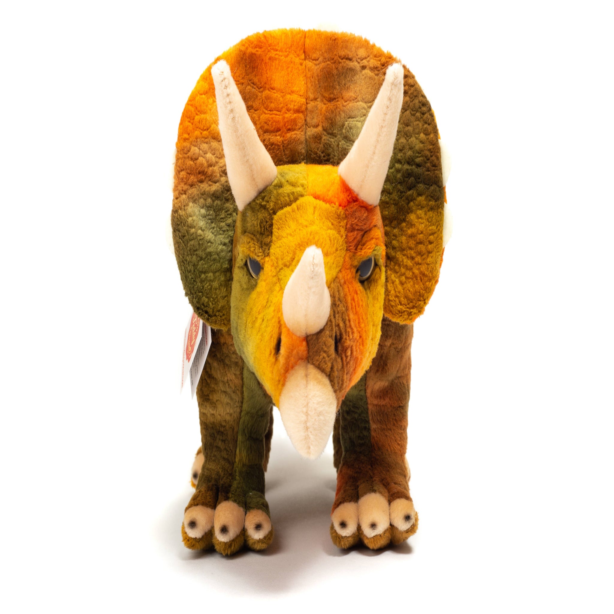 Plush triceratops toy on a white background
