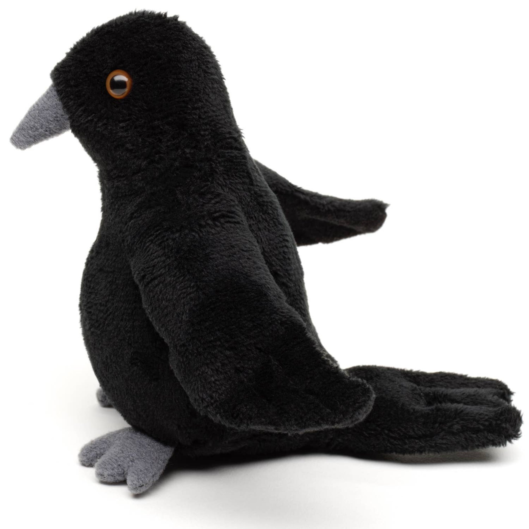 Black plush pigeon toy on a white background
