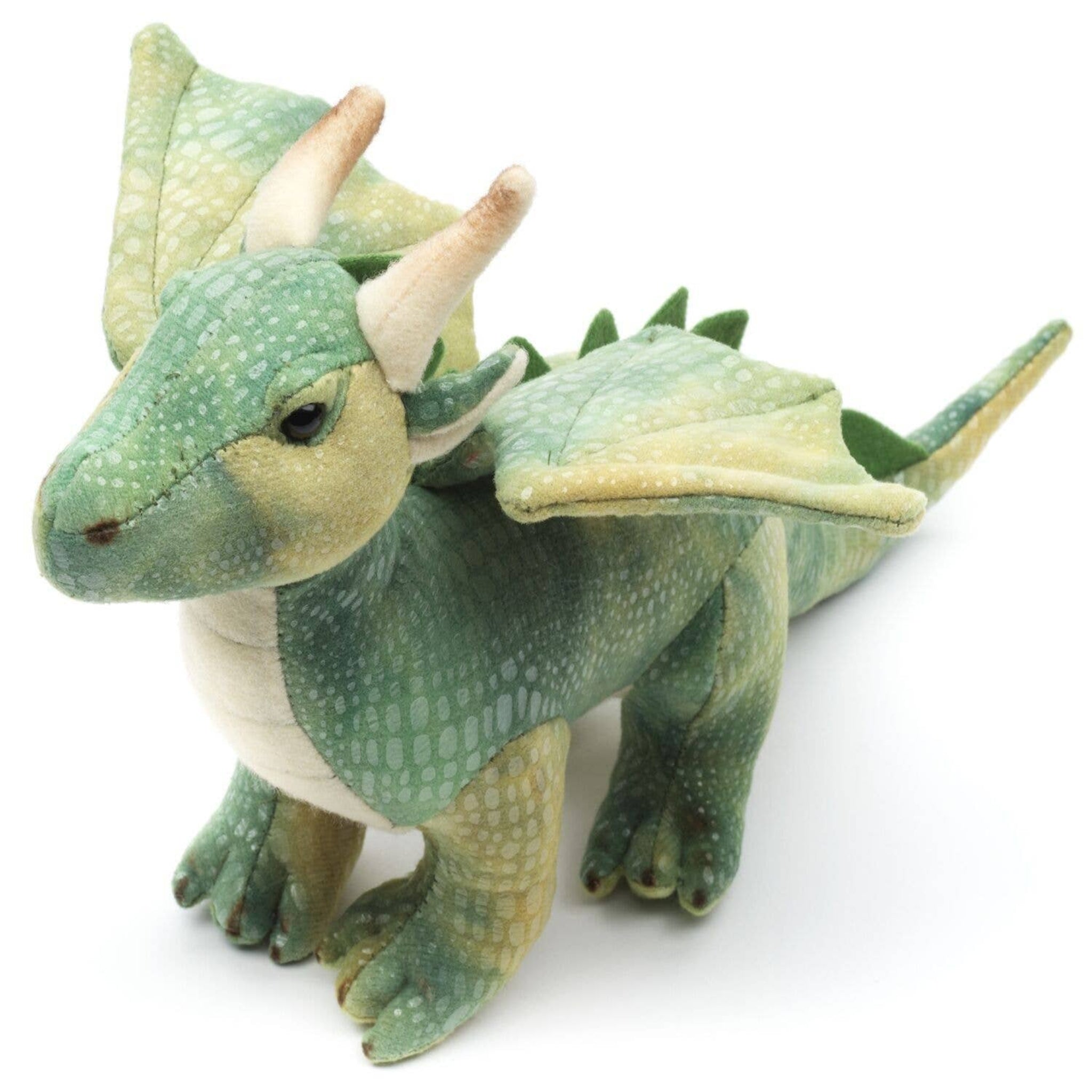 Green plush dragon toy on a white background