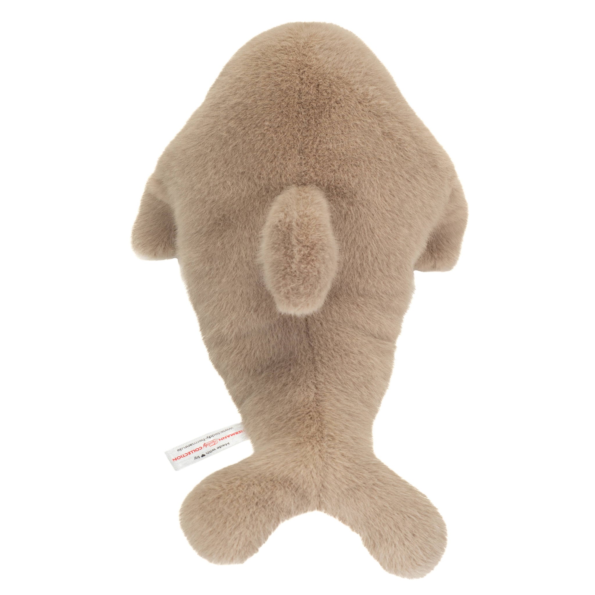 Plush toy whale on a white background