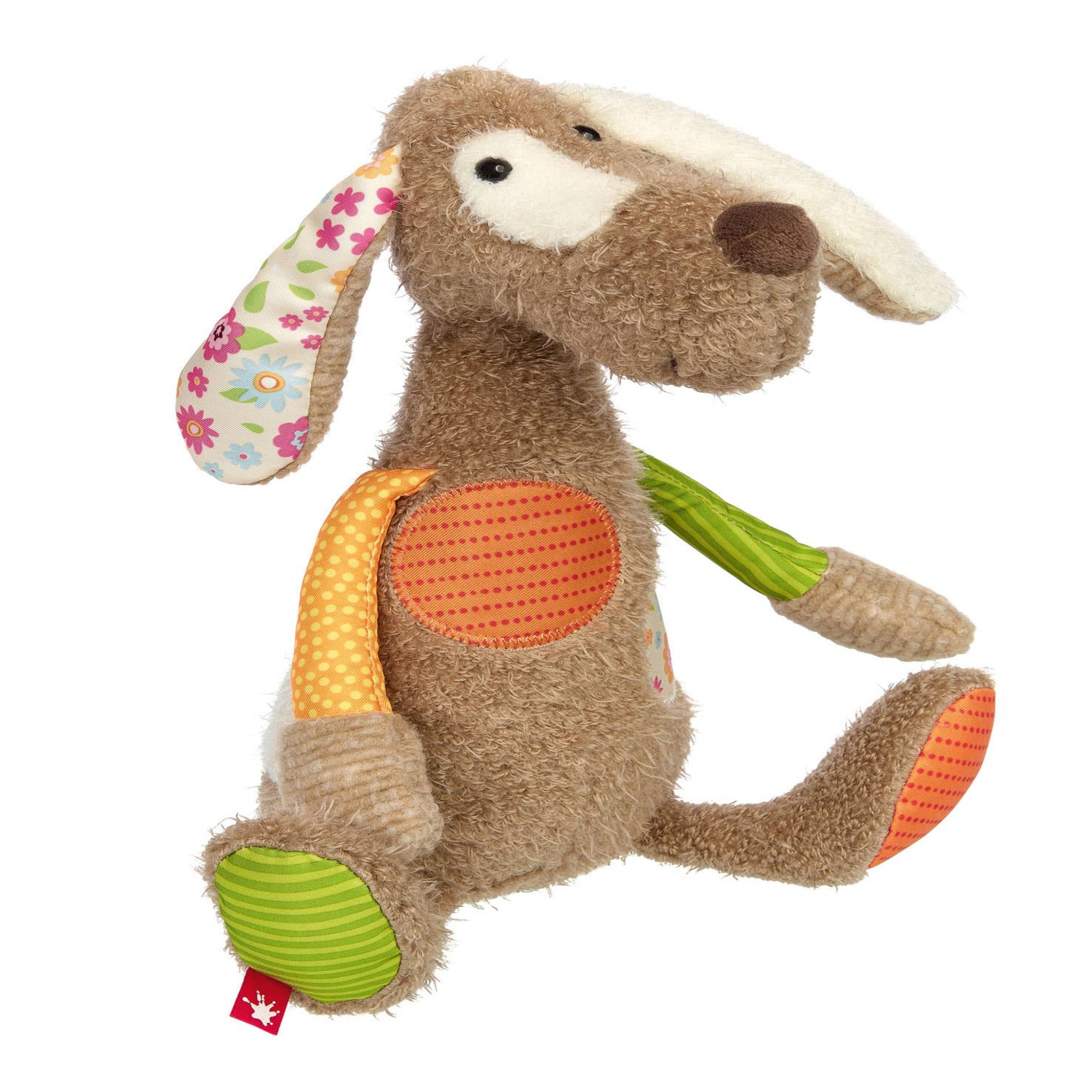 Plush toy dog with colorful scarf on a white background