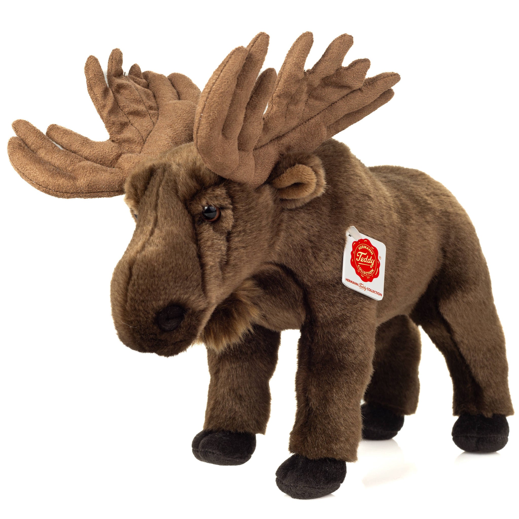 Plush moose toy with a visible tag on a white background